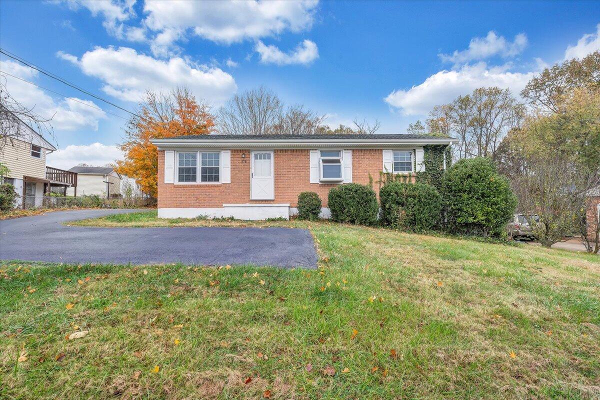 570 Scuffling Hill Road Rocky Mount, VA 24151 - Photo 35 of 35 a front view of a house with a yard and garage