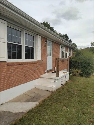 a house with trees in the background