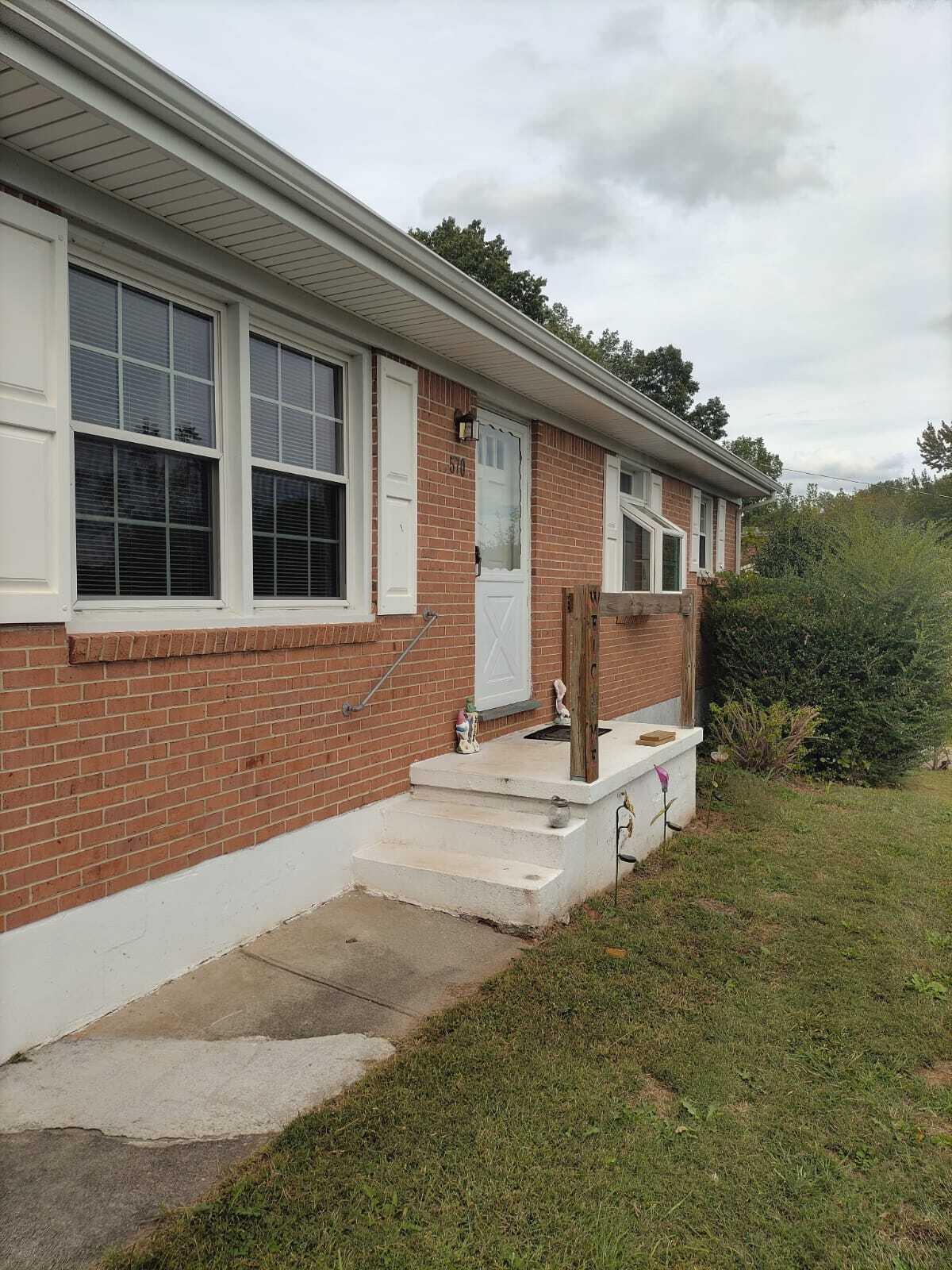 570 Scuffling Hill Road Rocky Mount, VA 24151 - Photo 4 of 35 a house with trees in the background