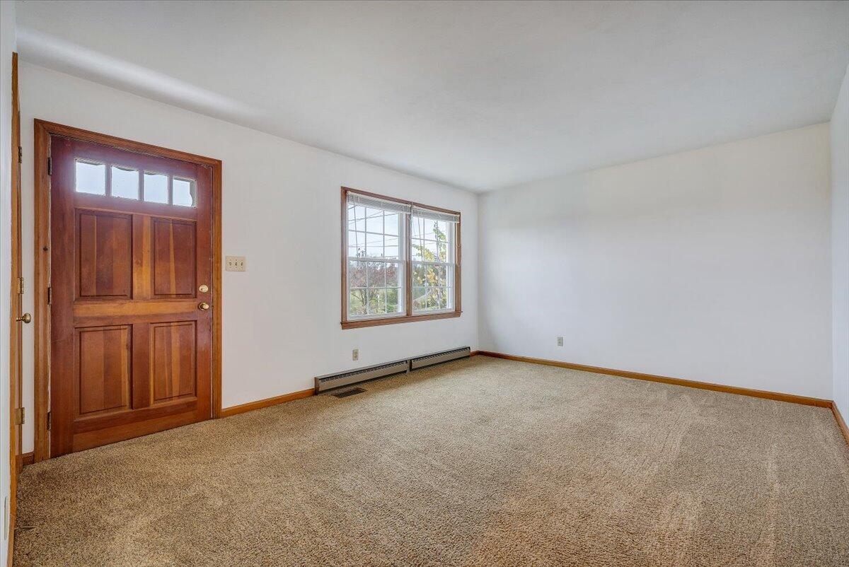 570 Scuffling Hill Road Rocky Mount, VA 24151 - Photo 5 of 35 an empty room with windows