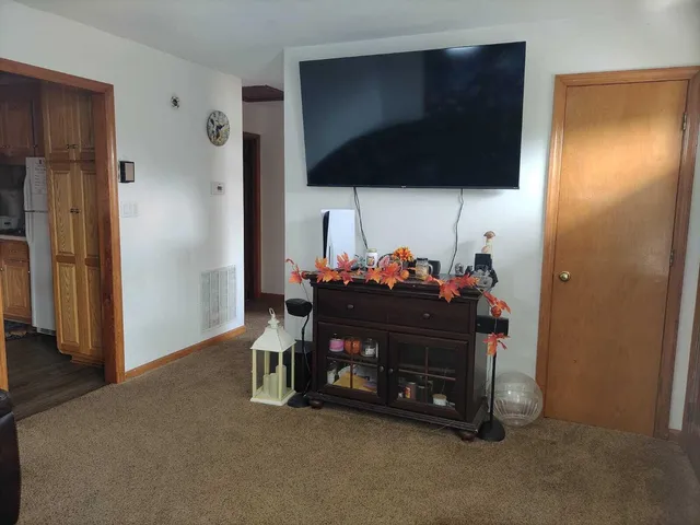 a room with furniture and a flat screen tv