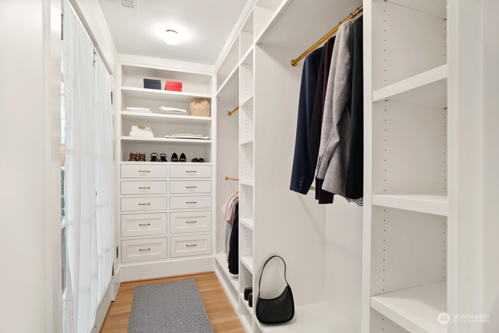 3700 Cascadia Avenue South Seattle, WA 98144 - Photo 25 of 39 a view of walk in closet with clothes and shoes
