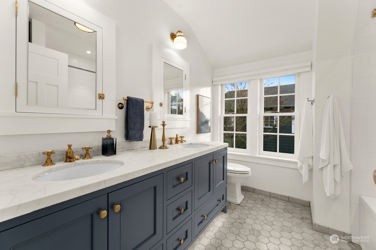 3700 Cascadia Avenue South Seattle, WA 98144 - Photo 29 of 39 a bathroom with a double vanity sink a toilet and a window