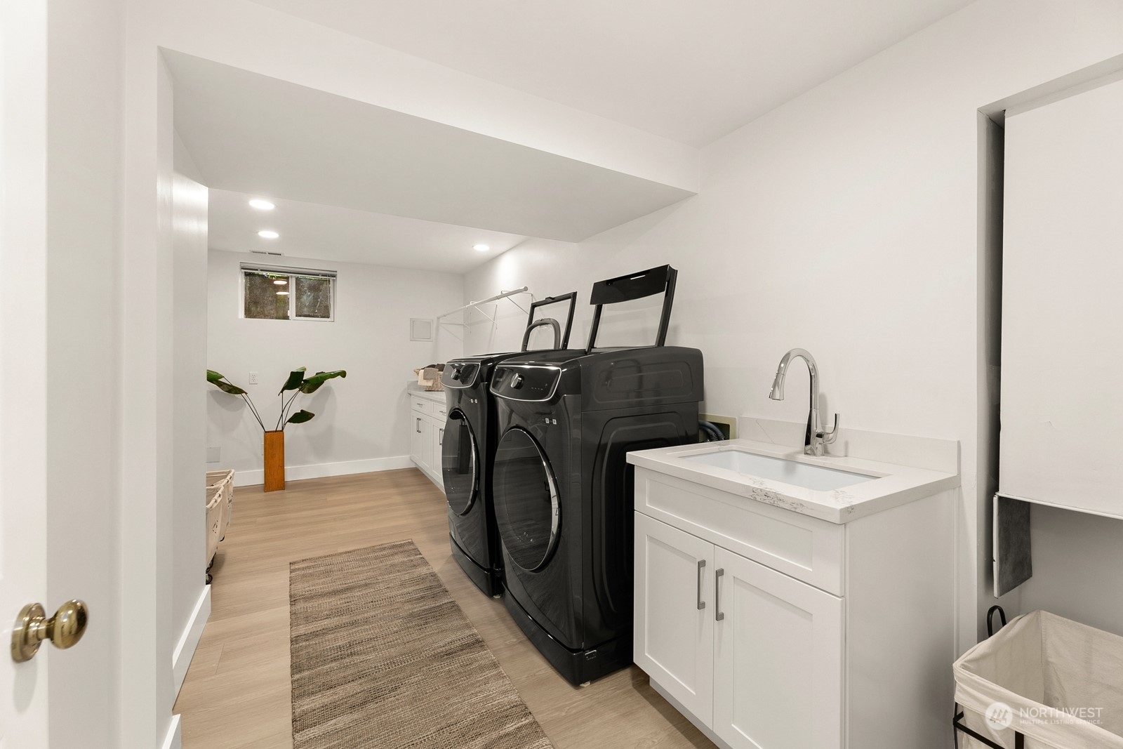 3700 Cascadia Avenue South Seattle, WA 98144 - Photo 30 of 39 a hallway with a washer and dryer