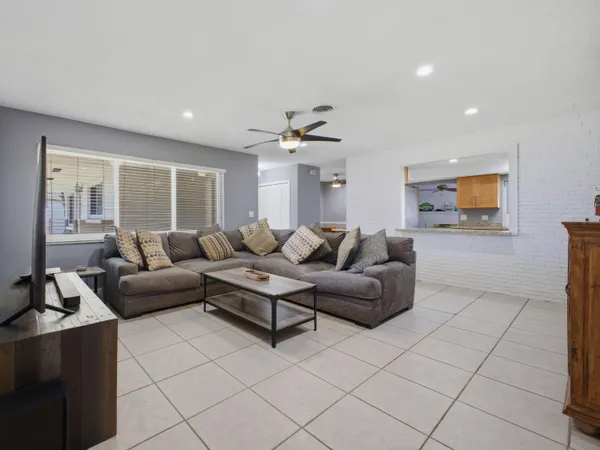 a living room with furniture and a window