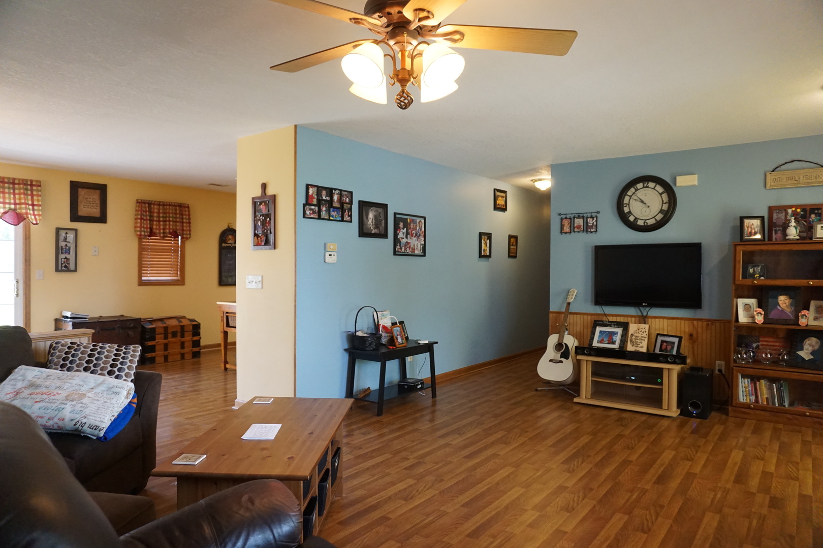 220 High Street Weldon, IL 61882 - Photo 11 of 33 a living room with furniture and a flat screen tv