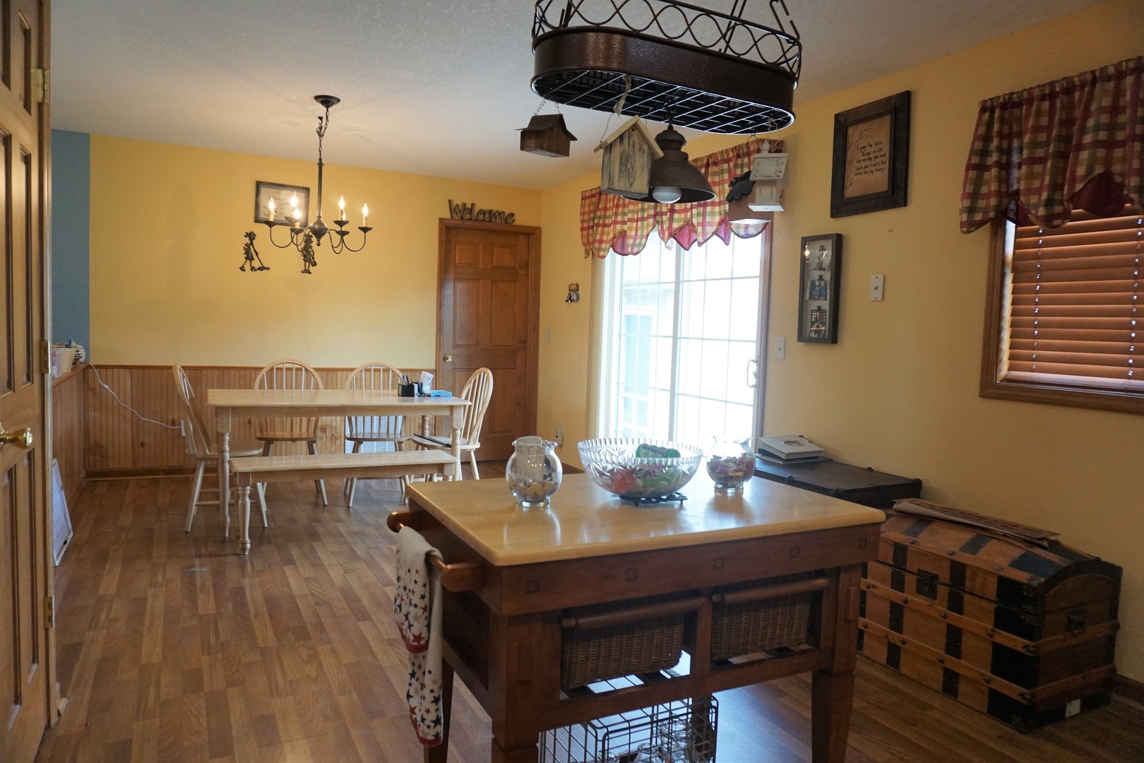 220 High Street Weldon, IL 61882 - Photo 13 of 33 a kitchen with a table chairs and flat screen tv