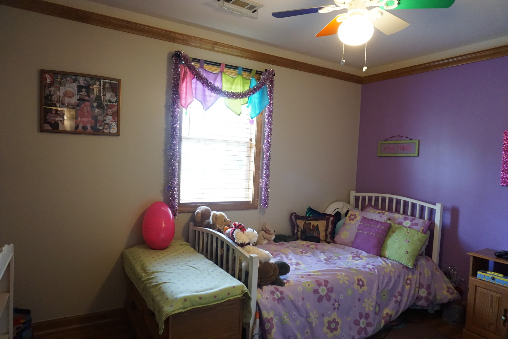 220 High Street Weldon, IL 61882 - Photo 28 of 33 a bedroom with a bed and a chandelier
