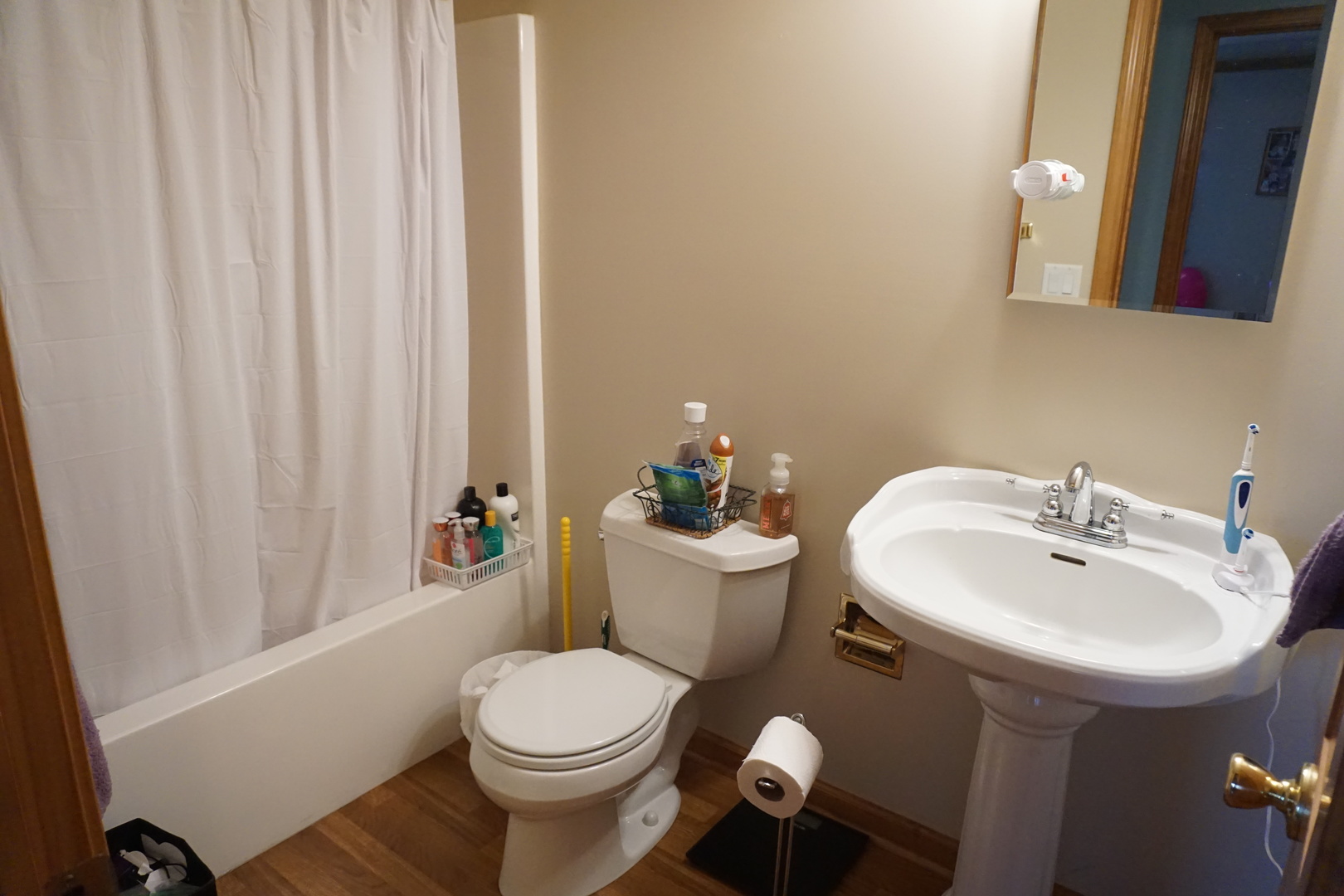 220 High Street Weldon, IL 61882 - Photo 30 of 33 a bathroom with a sink toilet and shower