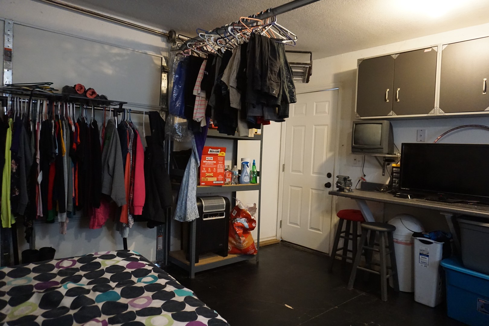 220 High Street Weldon, IL 61882 - Photo 32 of 33 a view of walk in closet with clothes and shoes