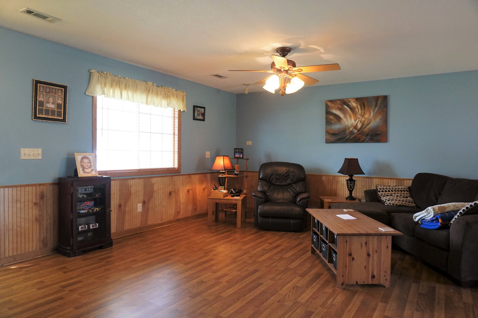 220 High Street Weldon, IL 61882 - Photo 9 of 33 a living room with furniture and a window