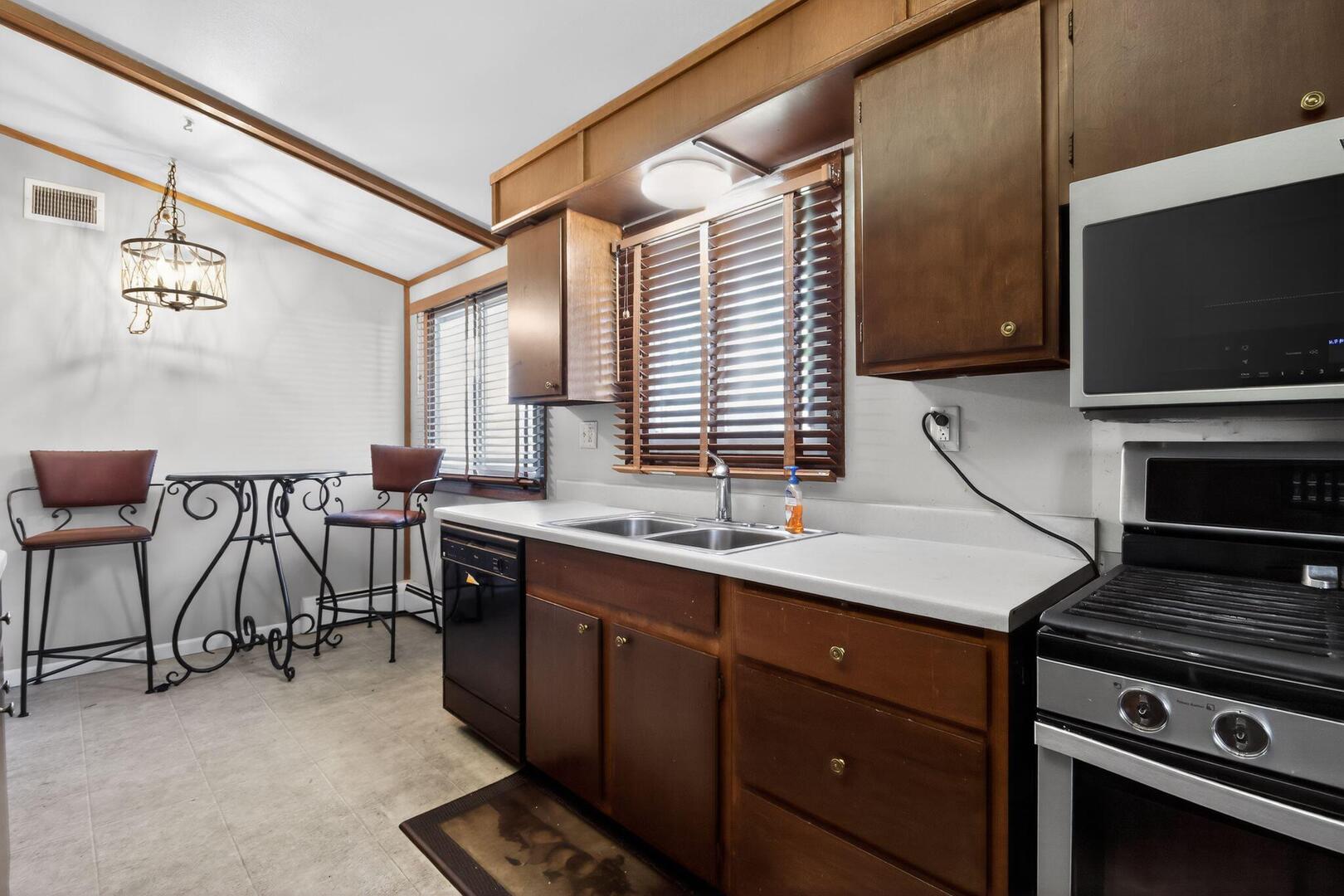 3552 North Water Street Decatur, IL 62526 - Photo 12 of 30 a kitchen with a sink cabinets and wooden floor