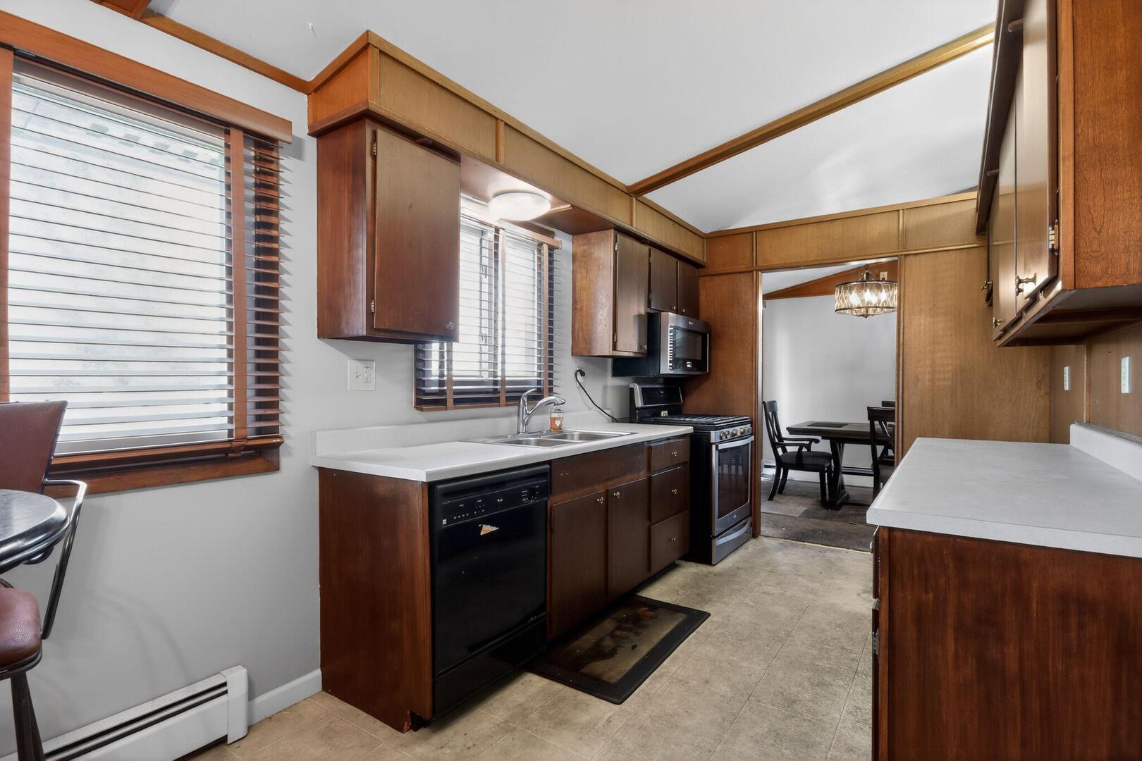 3552 North Water Street Decatur, IL 62526 - Photo 15 of 30 a kitchen with a sink cabinets and window