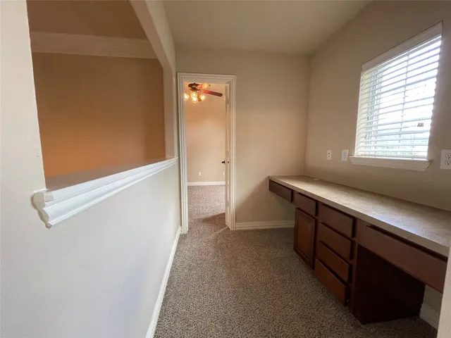 a view of hallway with windows