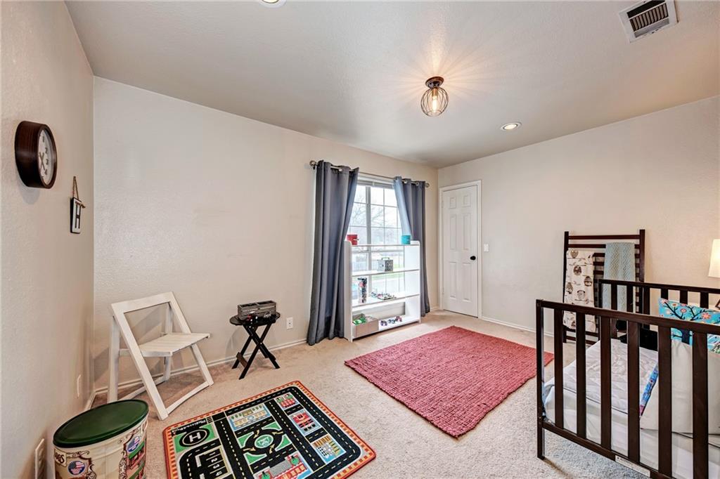 1813 White Oak Loop Round Rock, TX 78681 - Photo 26 of 30 a living room with furniture and a rug