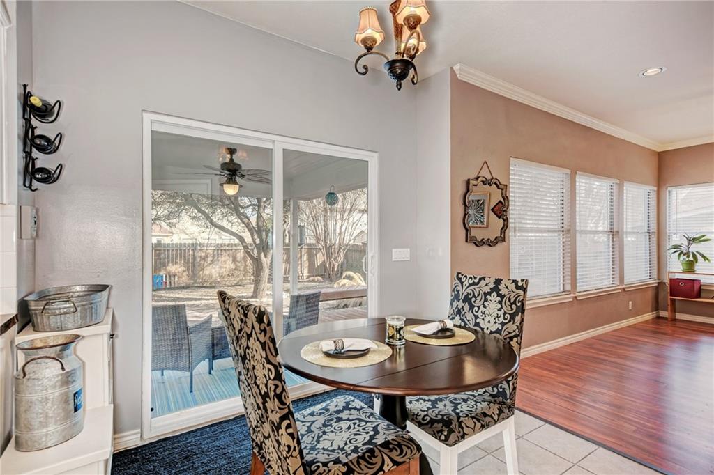1813 White Oak Loop Round Rock, TX 78681 - Photo 27 of 30 a view of a dining room with furniture window and wooden floor