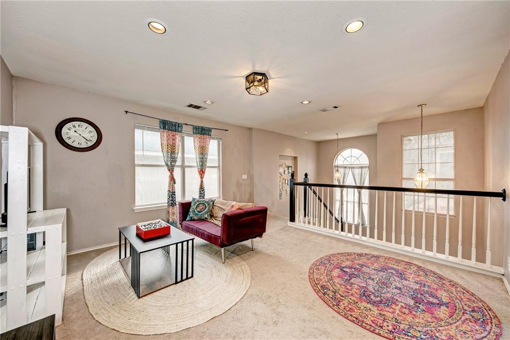 1813 White Oak Loop Round Rock, TX 78681 - Photo 28 of 30 a living room with furniture a window and a table