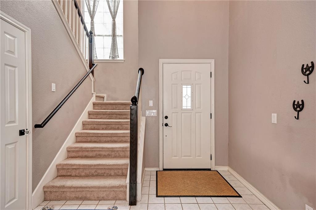1813 White Oak Loop Round Rock, TX 78681 - Photo 6 of 30 a view of entryway with wooden floor and stairs