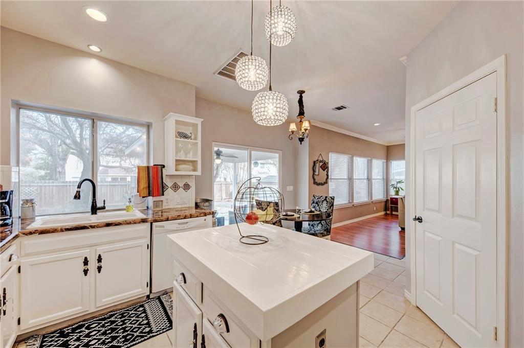 1813 White Oak Loop Round Rock, TX 78681 - Photo 10 of 30 a large white kitchen with a large window