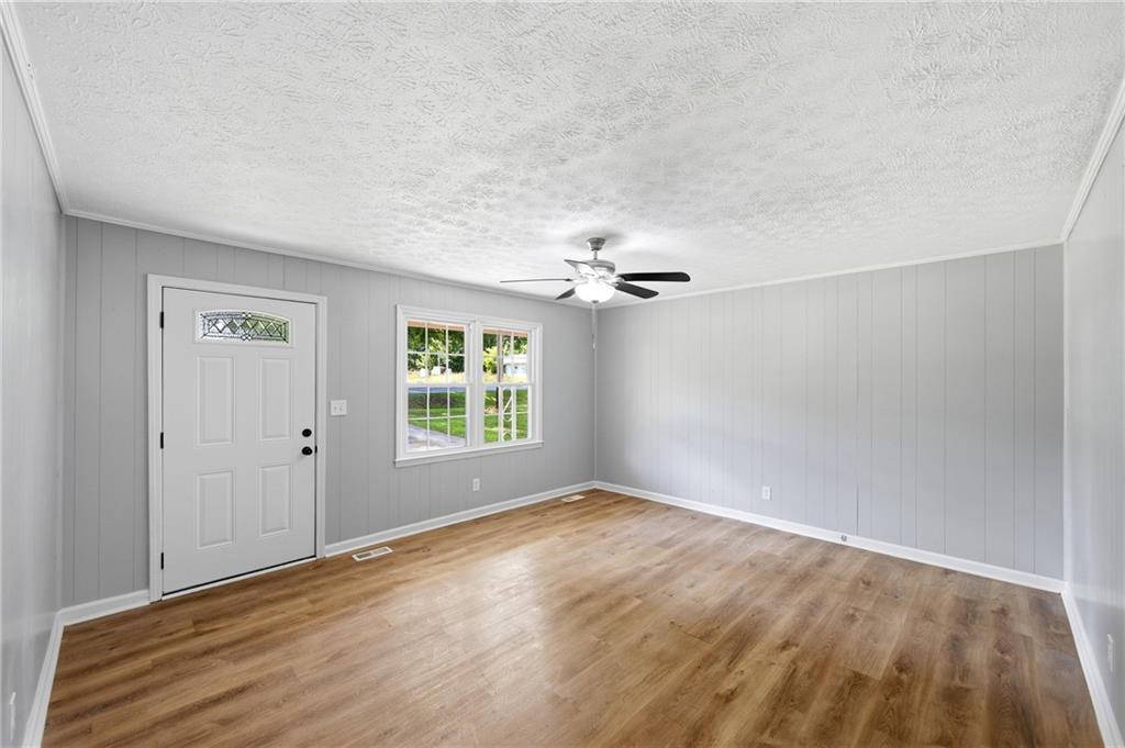 300 Cash Town Road Aragon, GA 30104 - Photo 10 of 28 wooden floor in an empty room with a window