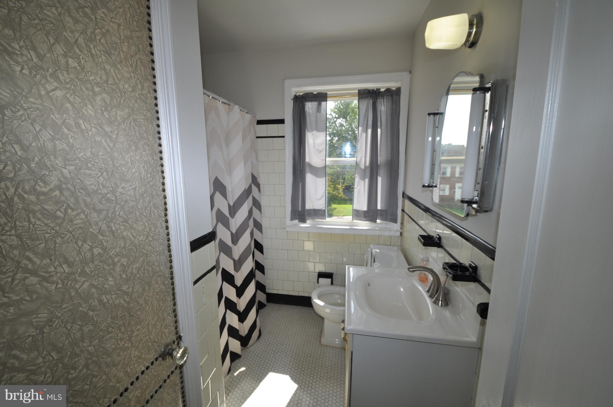 1434 Cedarcroft Road Baltimore, MD 21239 - Photo 12 of 15 HALL BATH CLOSE TO ALL BEDROOMS