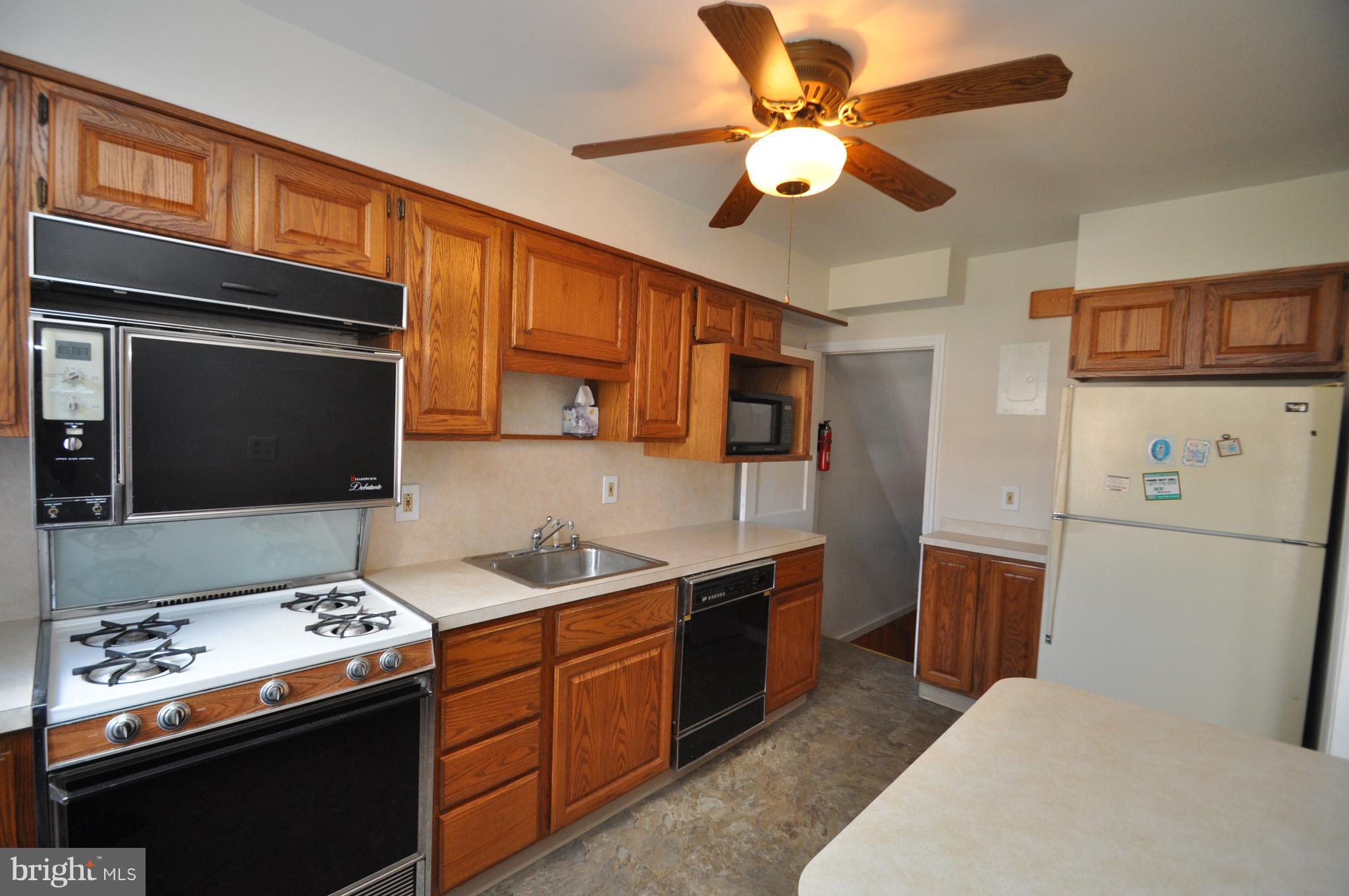 1434 Cedarcroft Road Baltimore, MD 21239 - Photo 6 of 15 ROOMY KITCHEN WITH NEW FLOORING!
