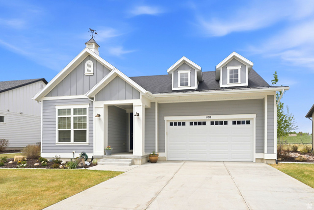 Contemporary gray siding exterior with white trim accents