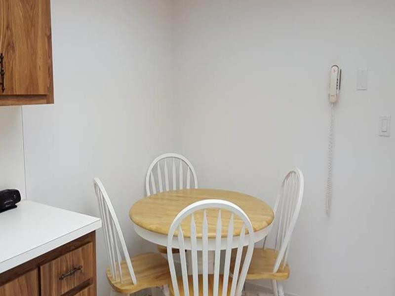 16251 Golf Club Road, Unit 210 Weston, FL 33326 - Photo 14 of 28 a view of a dining room with furniture