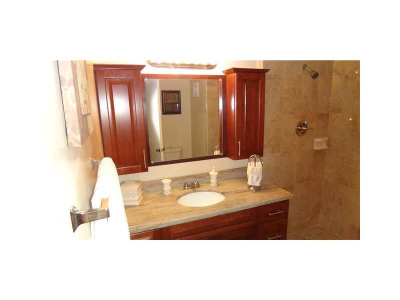 16251 Golf Club Road, Unit 210 Weston, FL 33326 - Photo 26 of 28 a bathroom with a sink vanity granite and a mirror