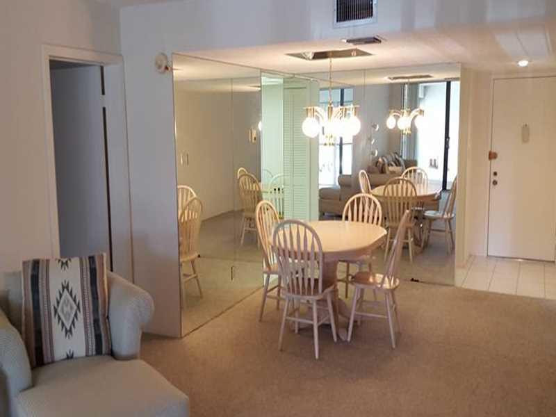 16251 Golf Club Road, Unit 210 Weston, FL 33326 - Photo 4 of 28 a dining room with furniture and window