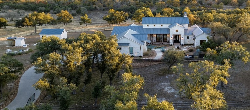Exquisite 1-story home on 10-acres redefines luxurious country living.