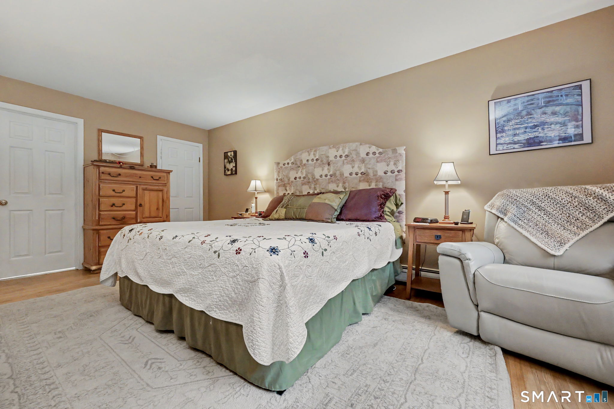 571 Wheeler Road Monroe, CT 06468 - Photo 25 of 40 a bedroom with a bed and a couch