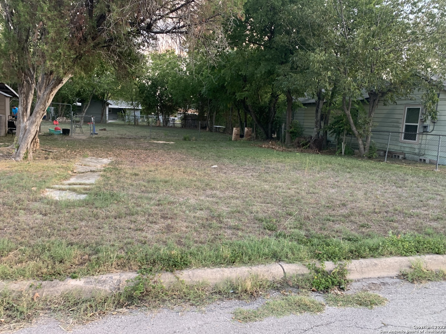 a backyard of a house with lots of green space