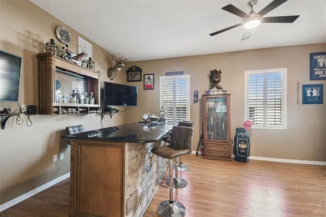 a bathroom with a sink a vanity and a mirror