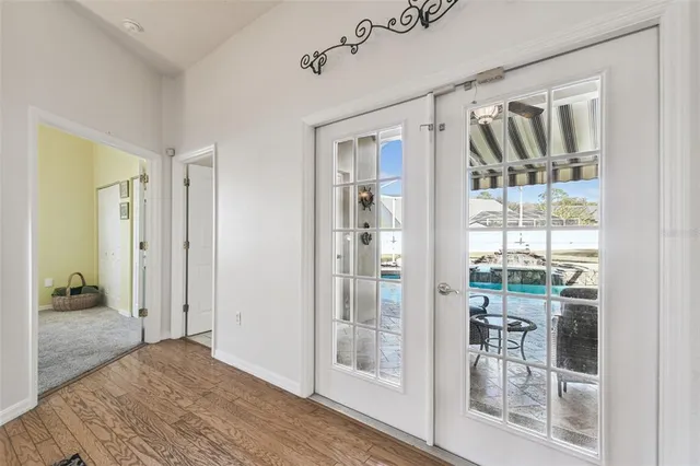 a view of a swimming pool with a yard and a fountain