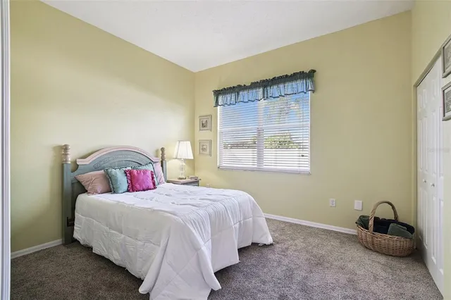 a view of a swimming pool with an outdoor seating