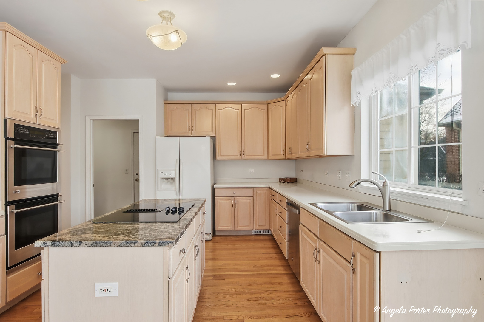7390 Bittersweet Drive Gurnee, IL 60031 - Photo 11 of 26 a kitchen with a sink stove and refrigerator