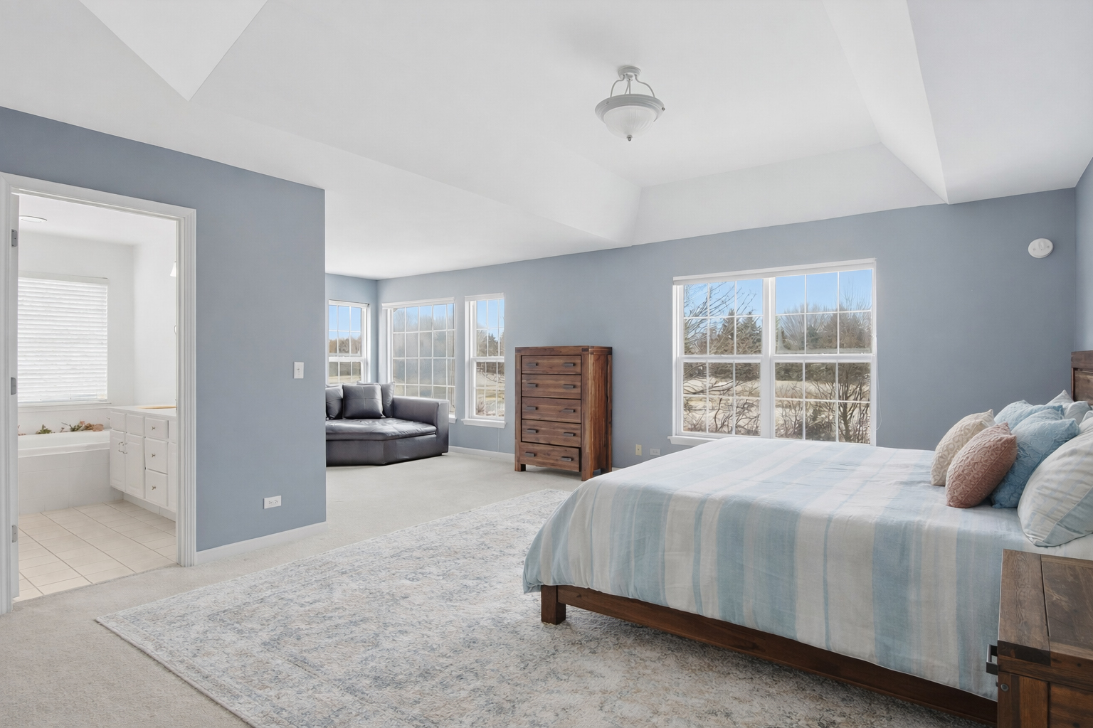 7390 Bittersweet Drive Gurnee, IL 60031 - Photo 15 of 26 a bedroom with a large bed and a large window