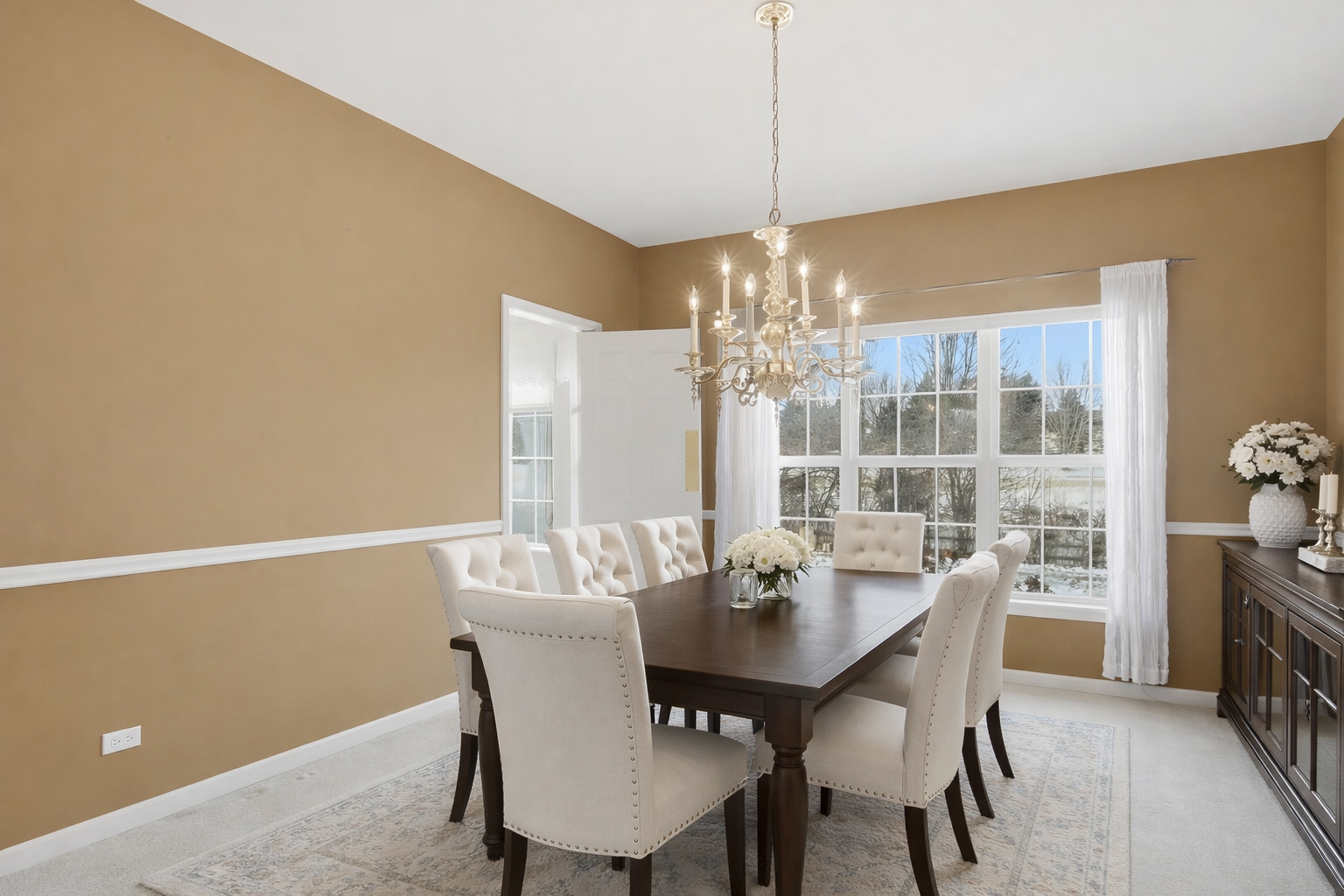 7390 Bittersweet Drive Gurnee, IL 60031 - Photo 8 of 26 a dining room with furniture a chandelier and kitchen view