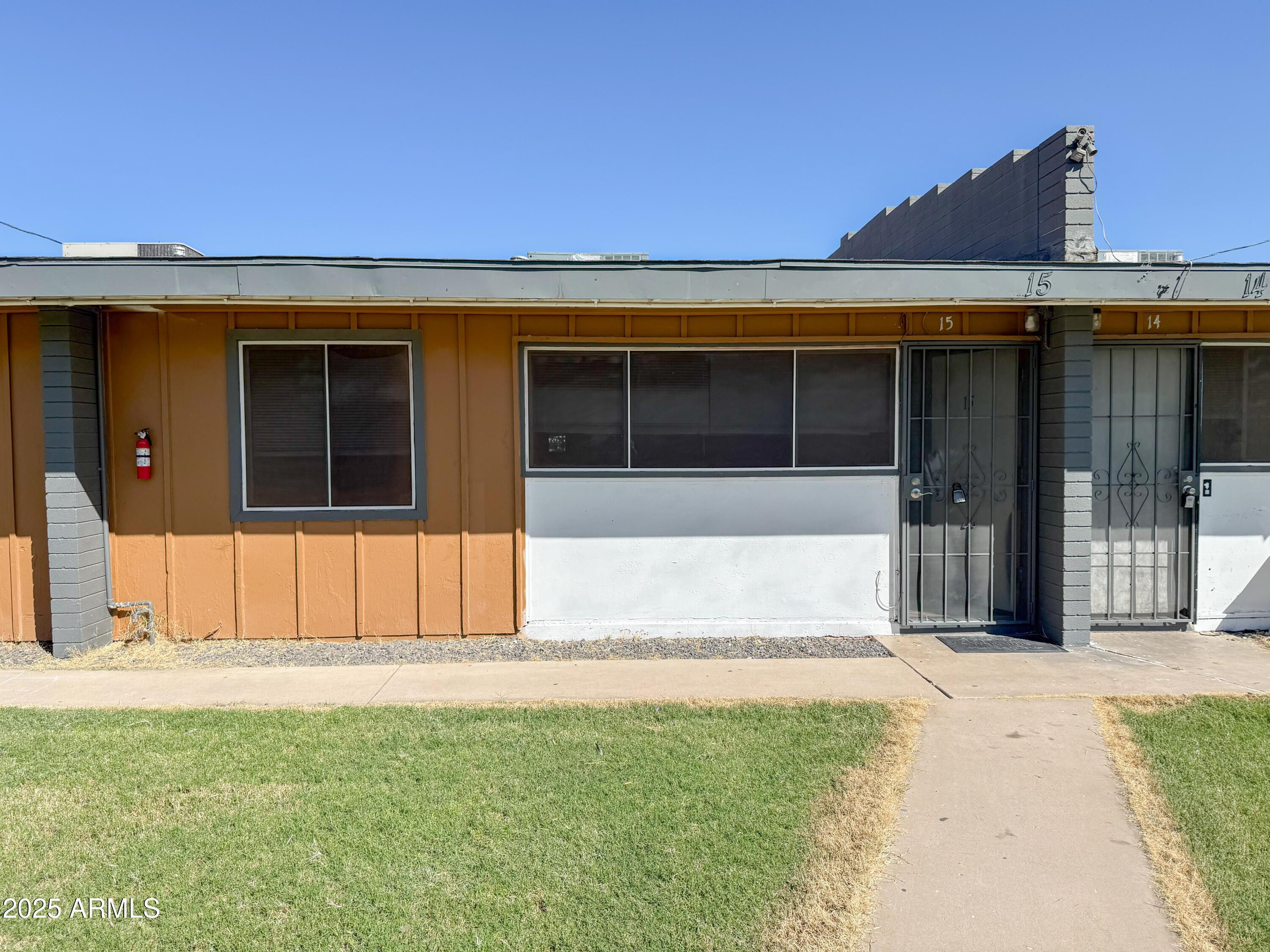 2123 West Devonshire Avenue, Unit 15 Phoenix, AZ 85015 - Photo 2 of 14 a front view of a house with a outdoor space