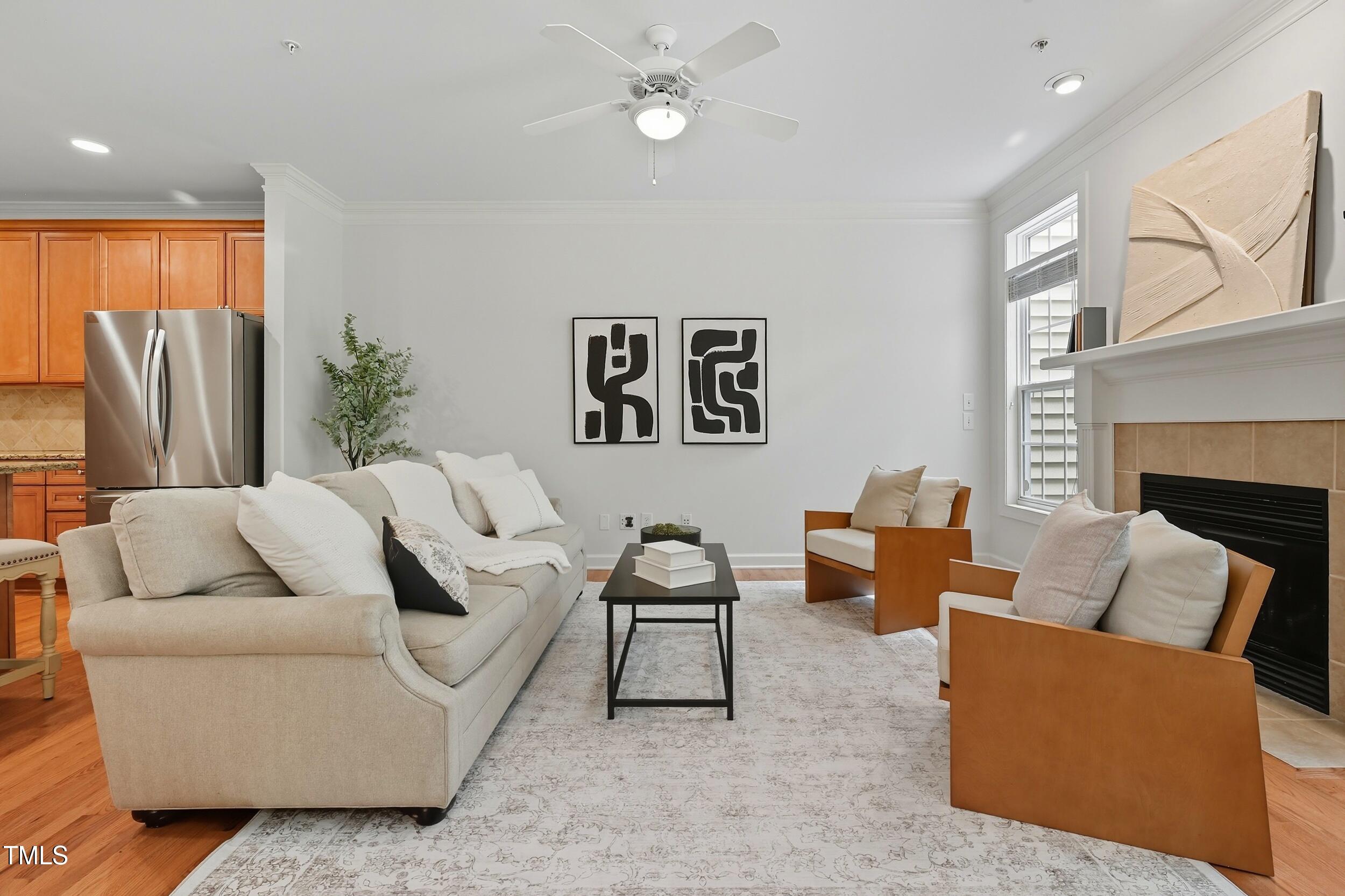 222 Towne Ridge Lane Chapel Hill, NC 27516 - Photo 16 of 39 a living room with furniture ceiling fan and a fireplace