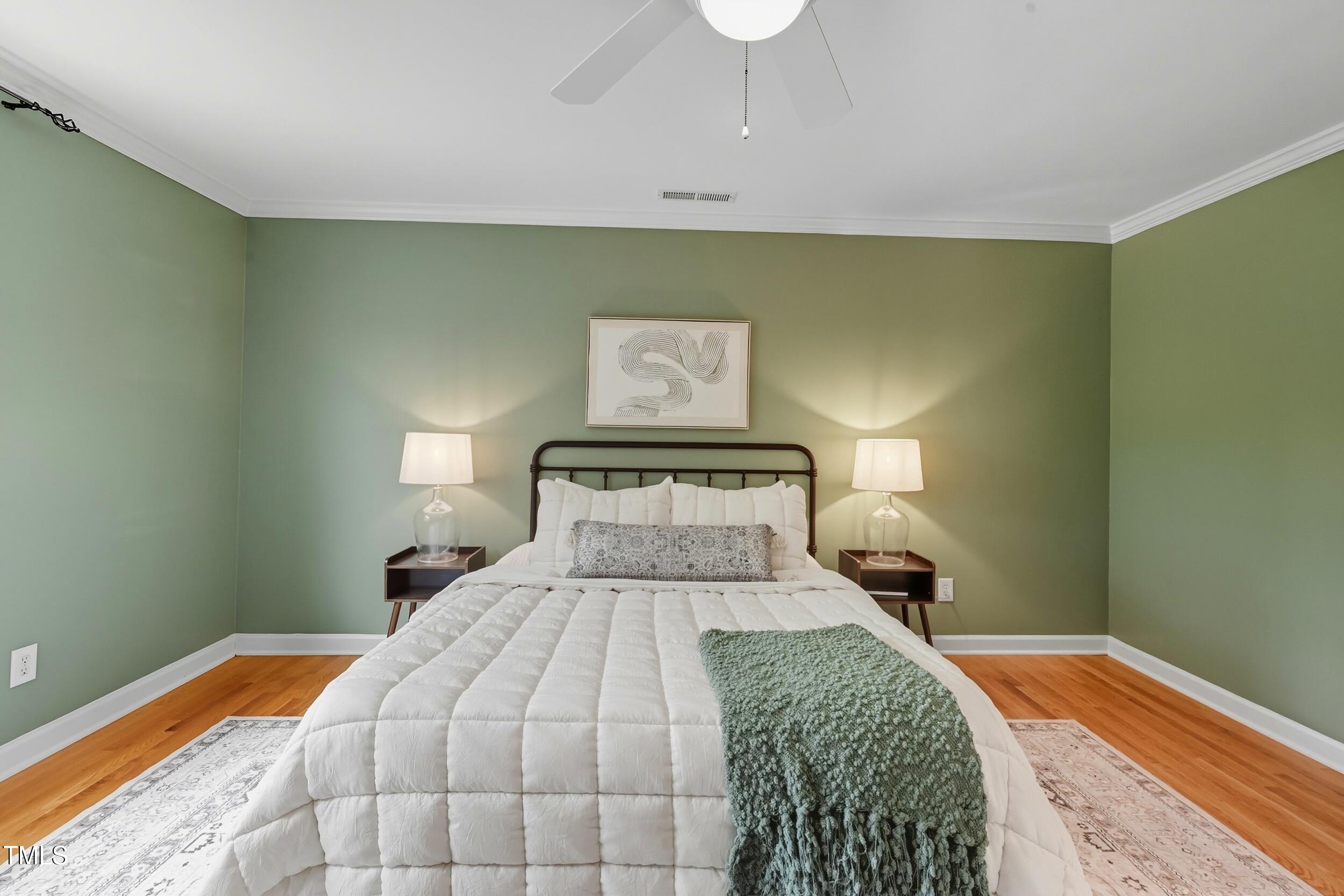 222 Towne Ridge Lane Chapel Hill, NC 27516 - Photo 21 of 39 a bedroom with a bed and a lamp on dresser