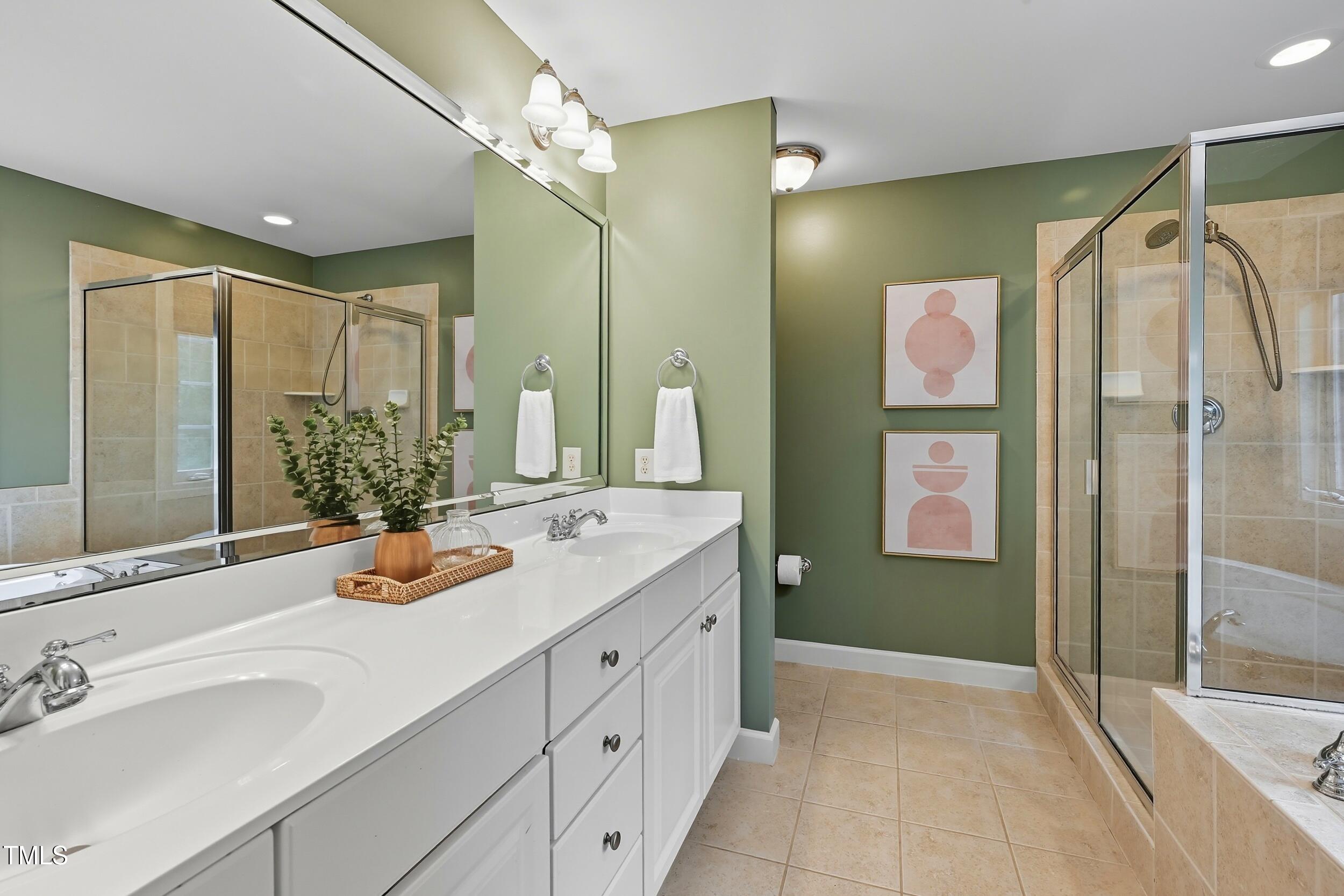 222 Towne Ridge Lane Chapel Hill, NC 27516 - Photo 22 of 39 a bathroom with a double vanity sink mirror and shower