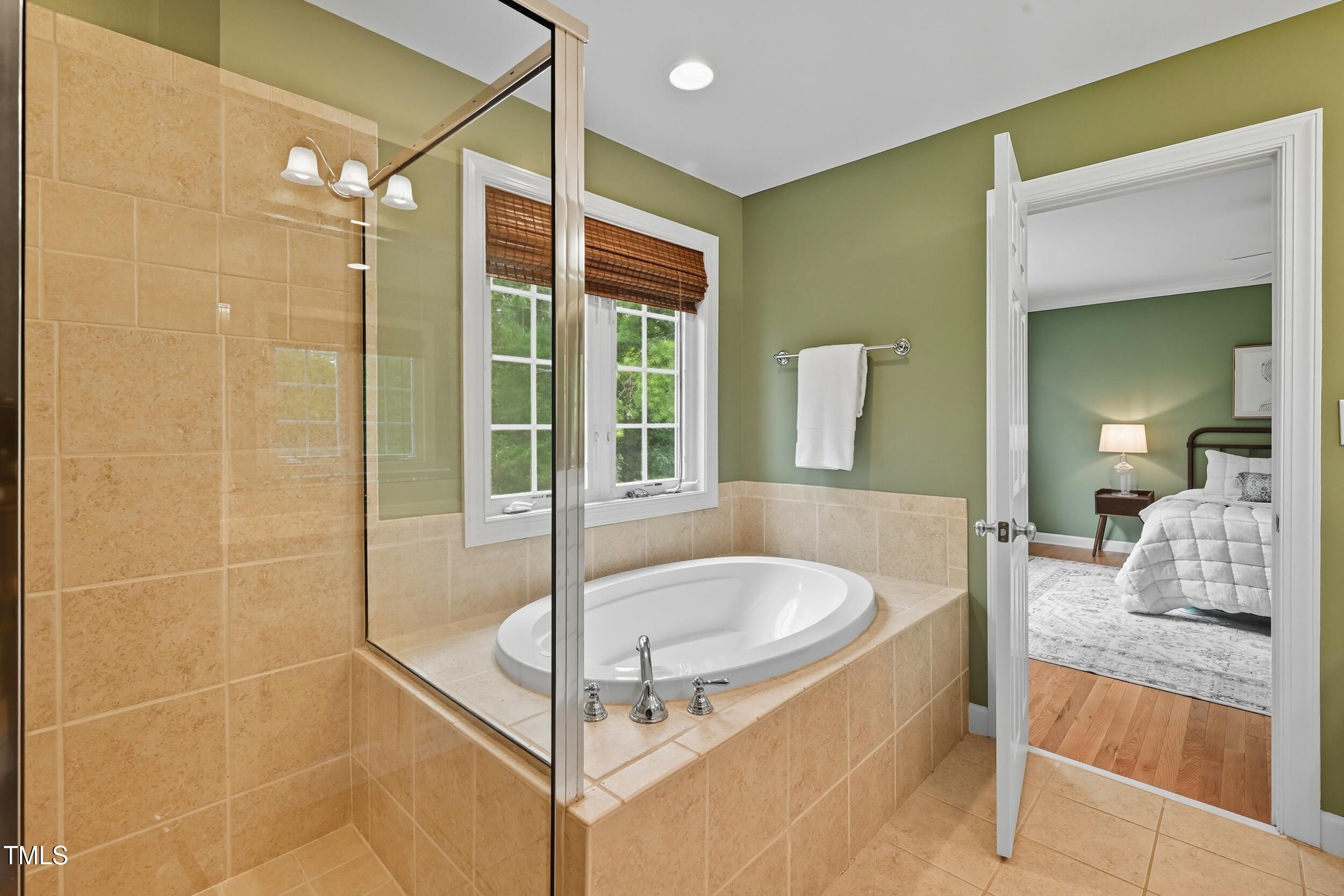 222 Towne Ridge Lane Chapel Hill, NC 27516 - Photo 23 of 39 a bathroom with a tub and a shower