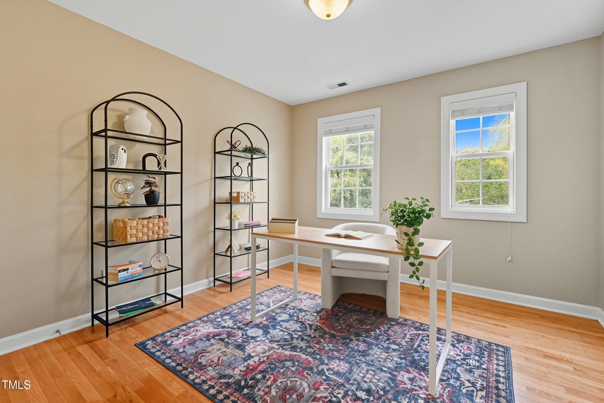222 Towne Ridge Lane Chapel Hill, NC 27516 - Photo 26 of 39 a living room with furniture a rug and a window