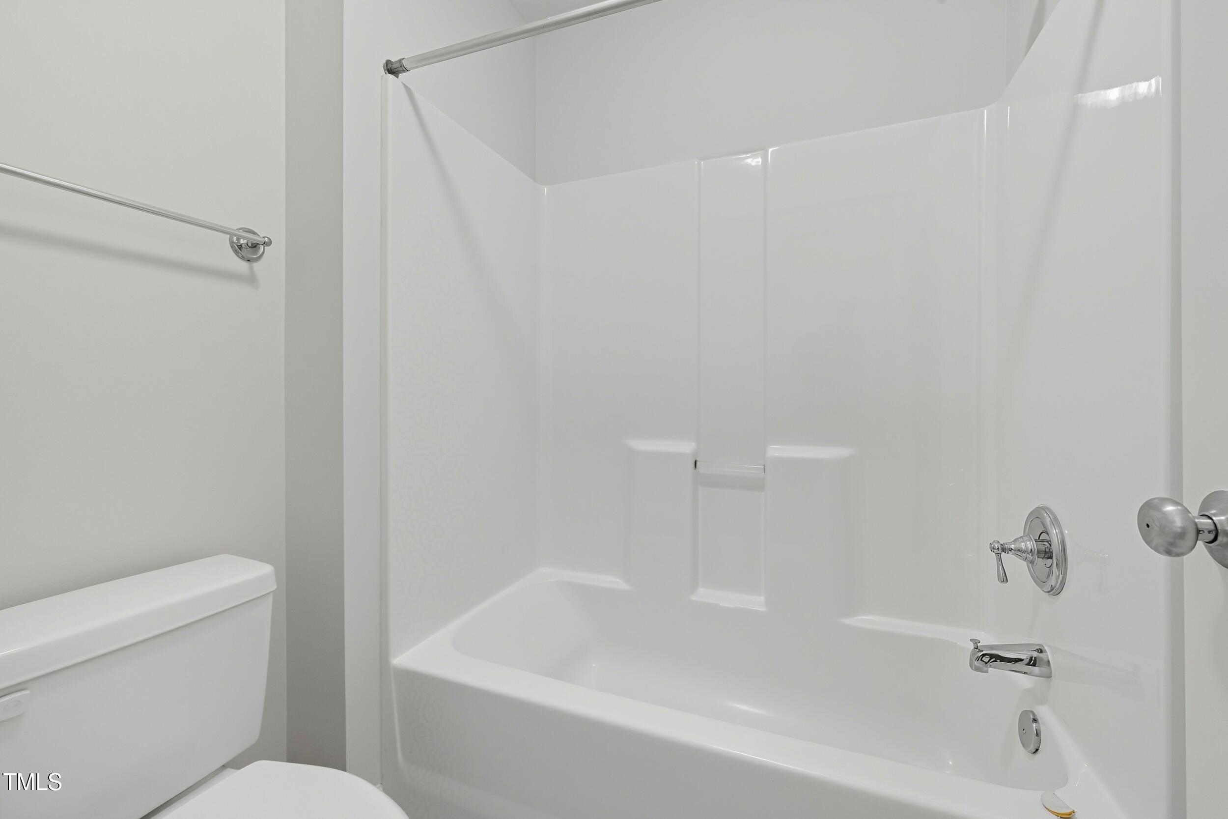 222 Towne Ridge Lane Chapel Hill, NC 27516 - Photo 31 of 39 a white bath tub sitting next to a white toilet and sink