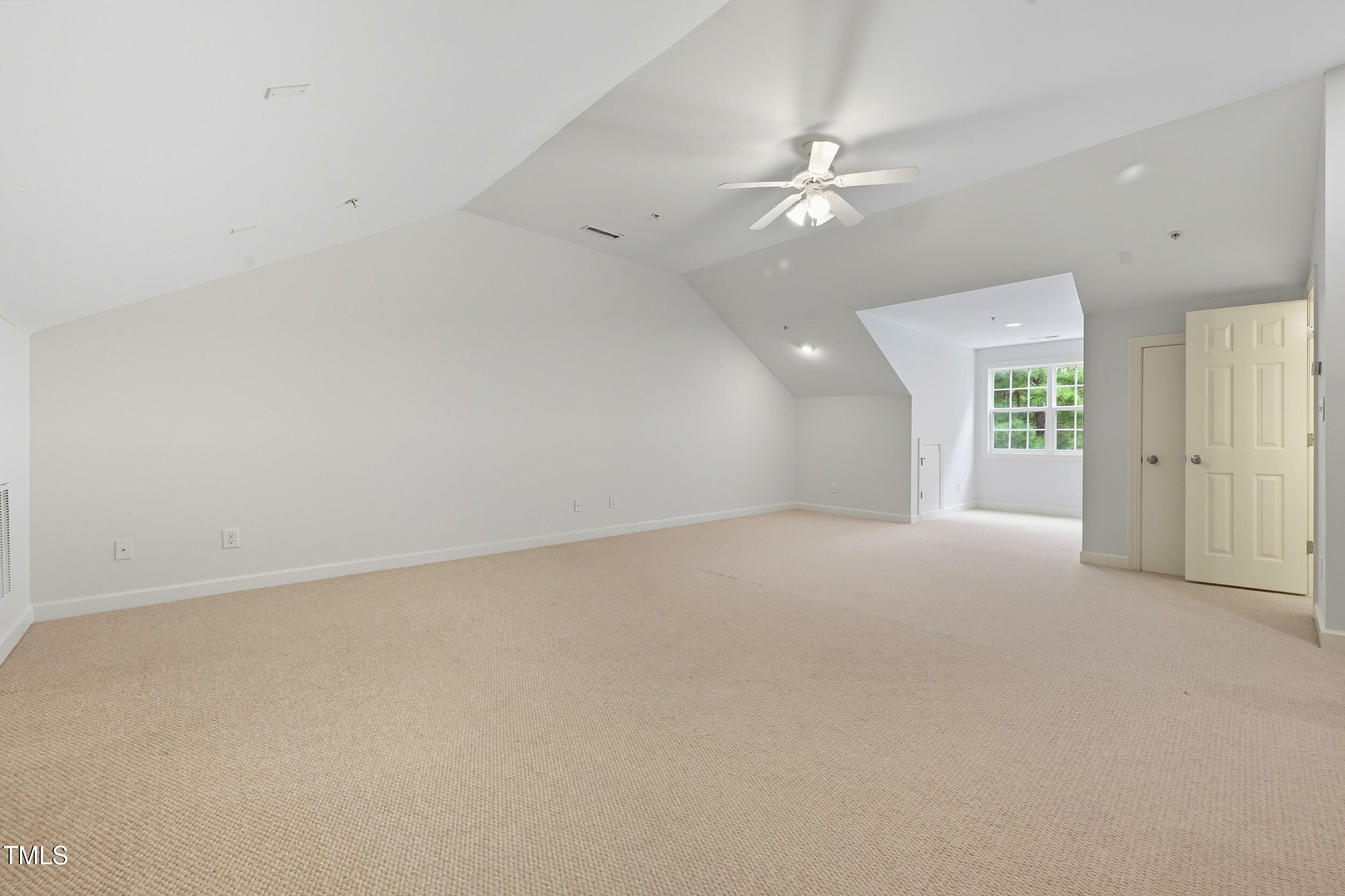 222 Towne Ridge Lane Chapel Hill, NC 27516 - Photo 33 of 39 an empty room with fan and windows