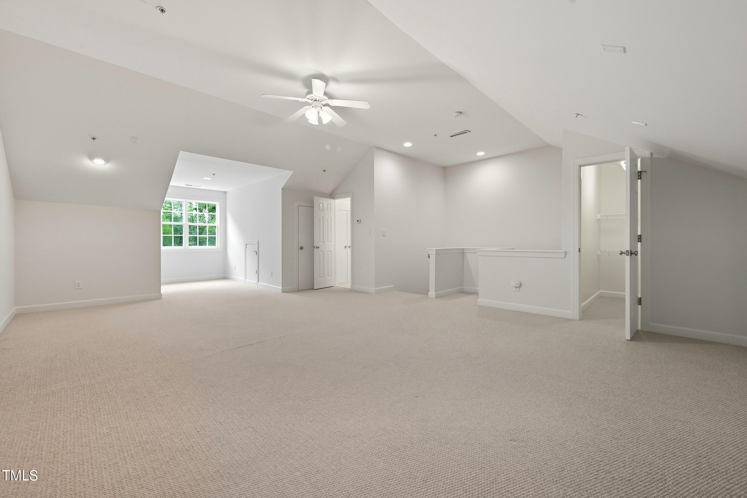 222 Towne Ridge Lane Chapel Hill, NC 27516 - Photo 34 of 39 an empty room with windows and fan