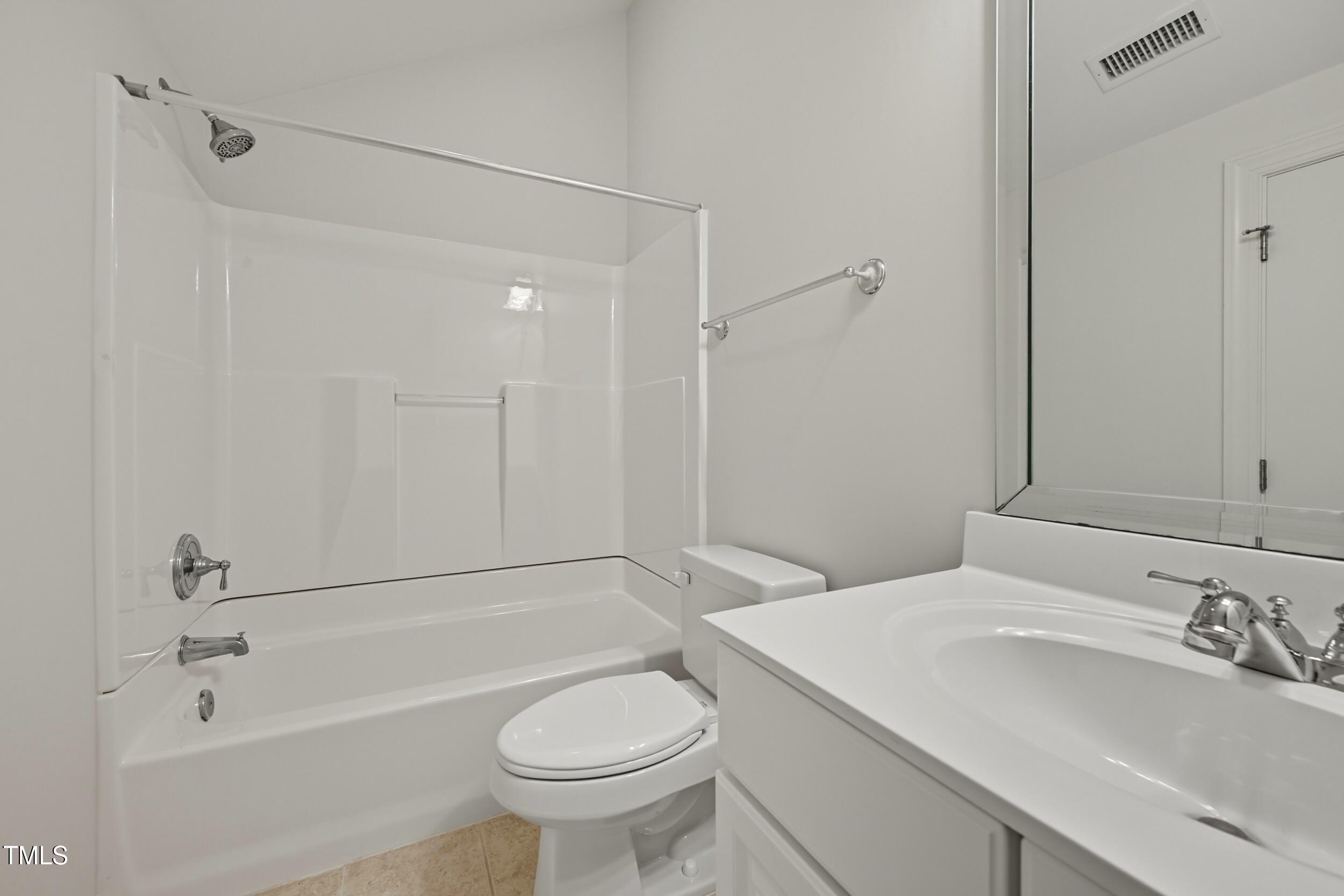 222 Towne Ridge Lane Chapel Hill, NC 27516 - Photo 36 of 39 a bathroom with a sink toilet vanity and shower