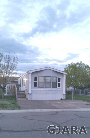 424 32 Road, Unit 294 Clifton, CO 81520 - Photo 3 of 9 a view of a house with a yard